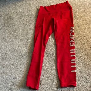 Red Lululemon leggings with name in leg